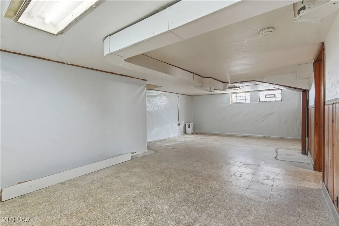 Below grade area featuring tile patterned floors