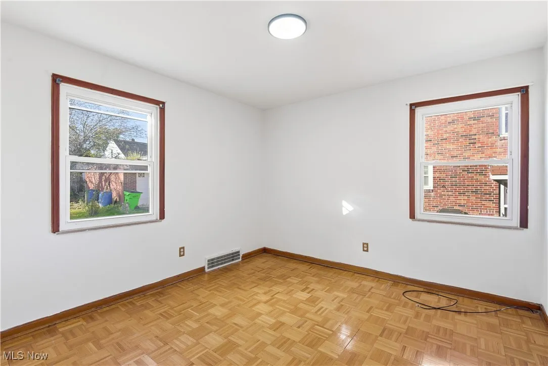 Empty room featuring baseboards