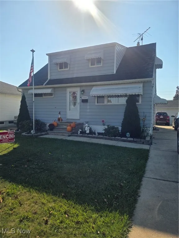 Bungalow-style home featuring a front lawn