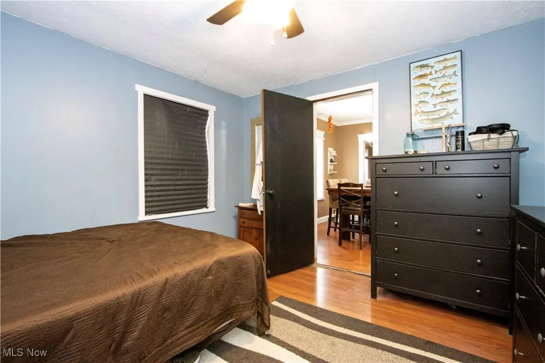 Bedroom featuring light wood finished floors and a ceiling fan