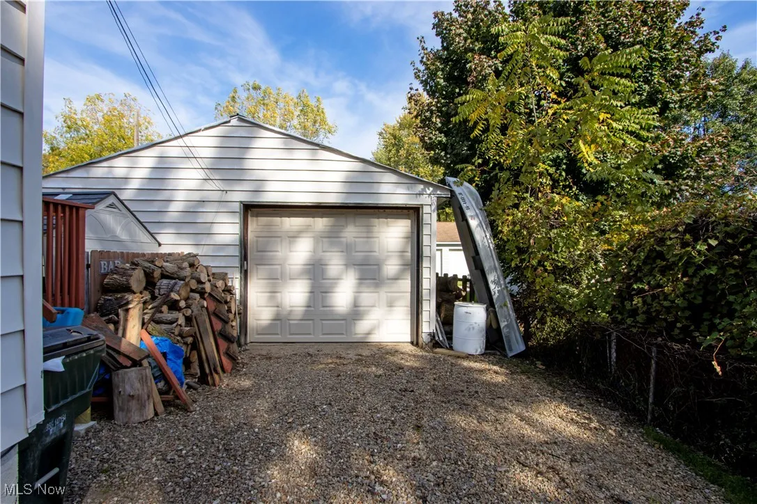 Detached garage featuring driveway