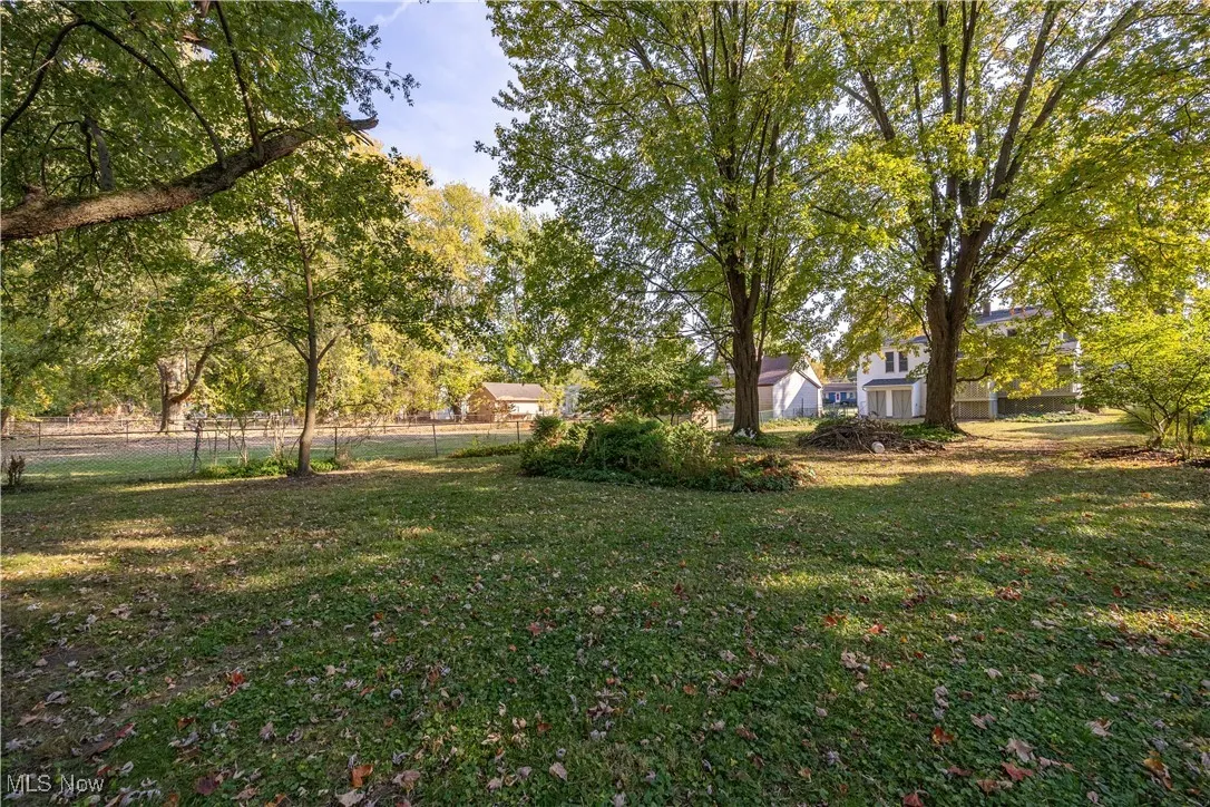 View of yard with view of wooded area