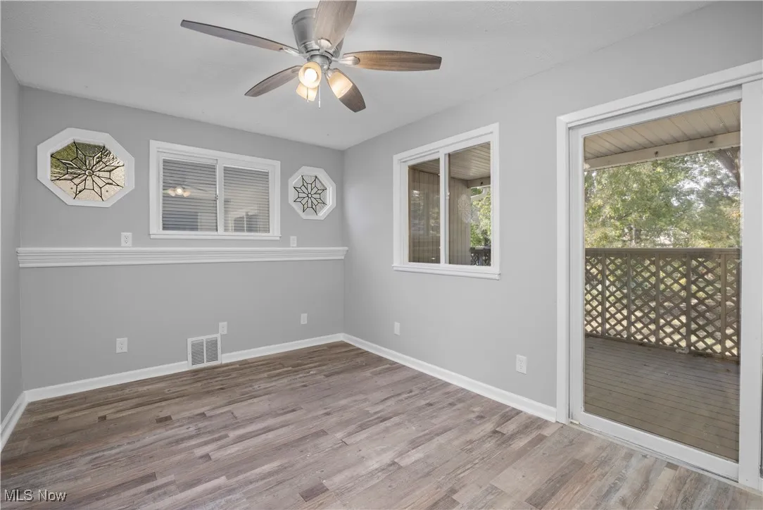 Unfurnished room featuring light wood-style flooring and a ceiling fan