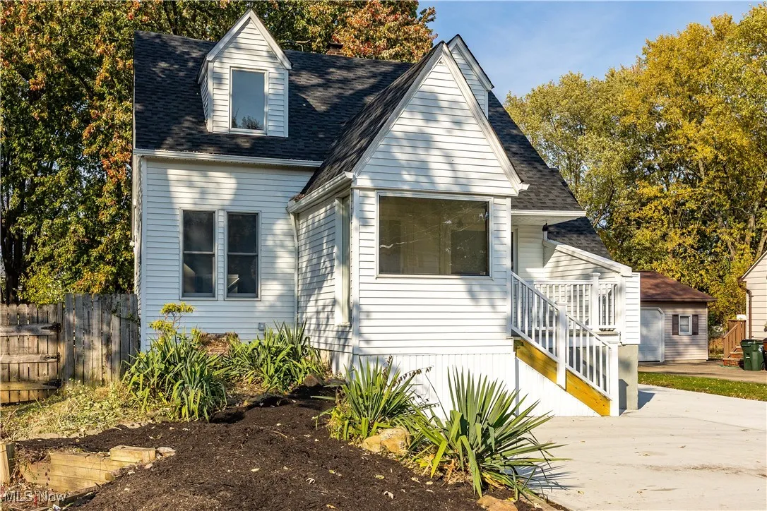 View of front of house featuring a shingled roof