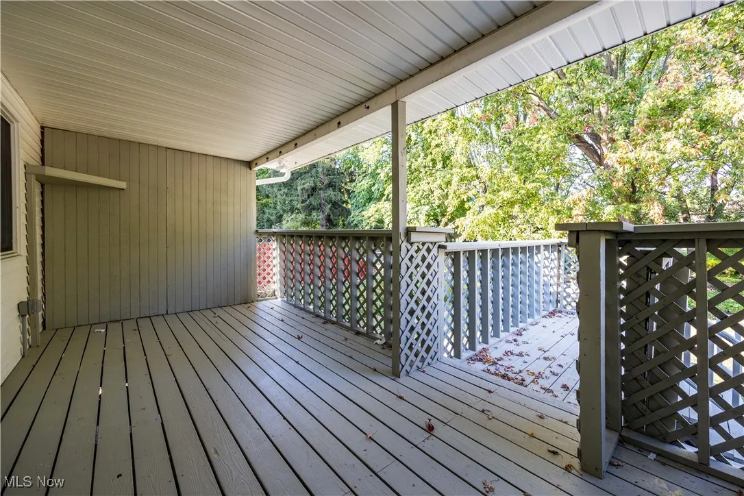 Deck featuring view of wooded area