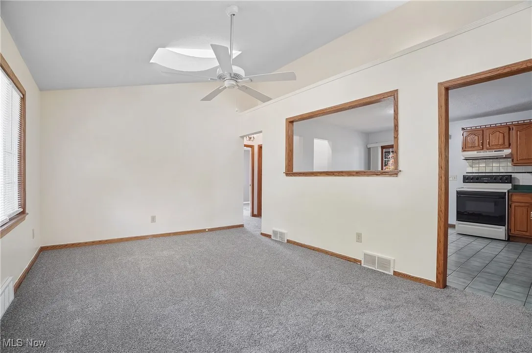 family room with vaulted ceiling