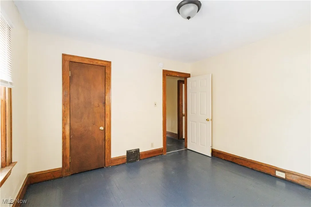 Unfurnished bedroom featuring baseboards and a closet