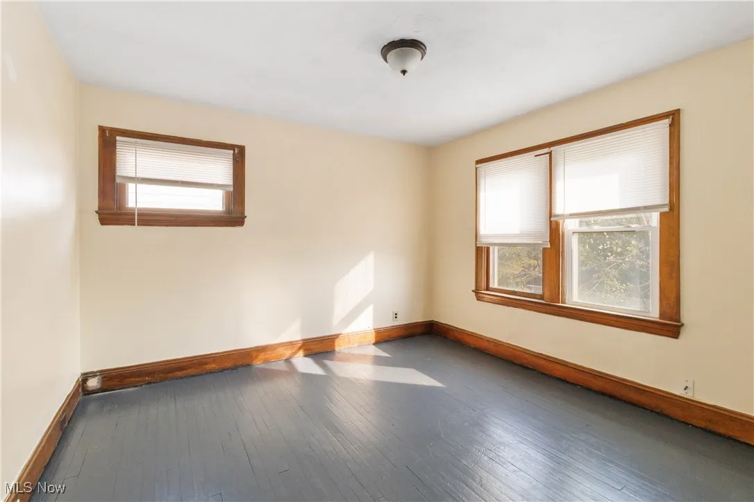 Empty room featuring wood-type flooring