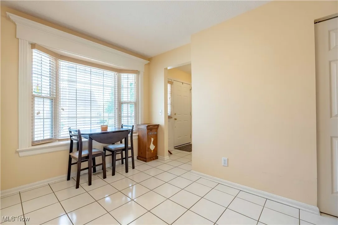 Dining room featuring healthy amount of natural light and light tile patterned floors