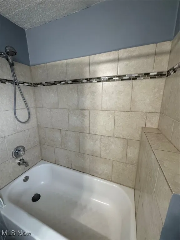 Half bathroom featuring toilet and baseboards