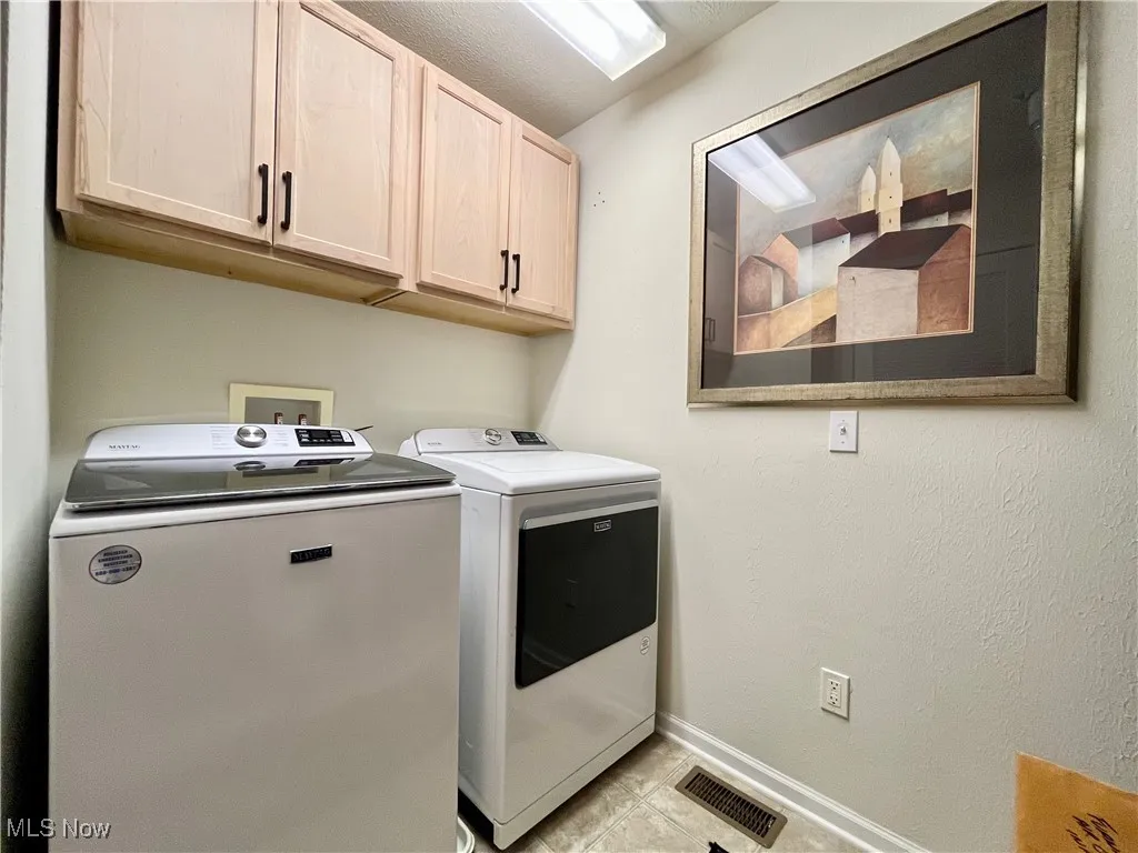 Laundry room with built-in cabinets