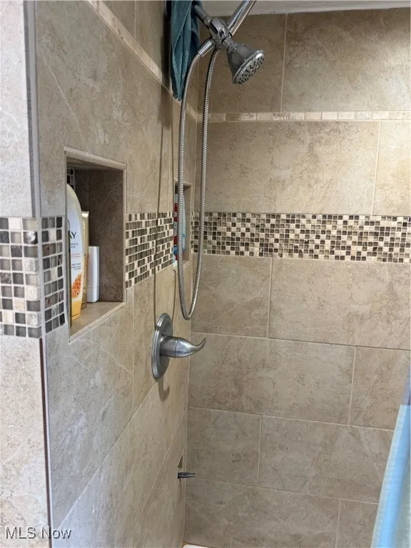 Bathroom view of a tile shower