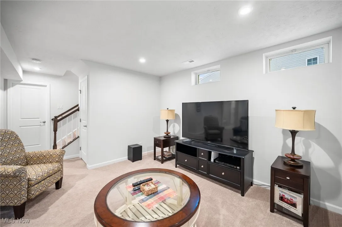 Living room featuring light carpet and recessed lighting