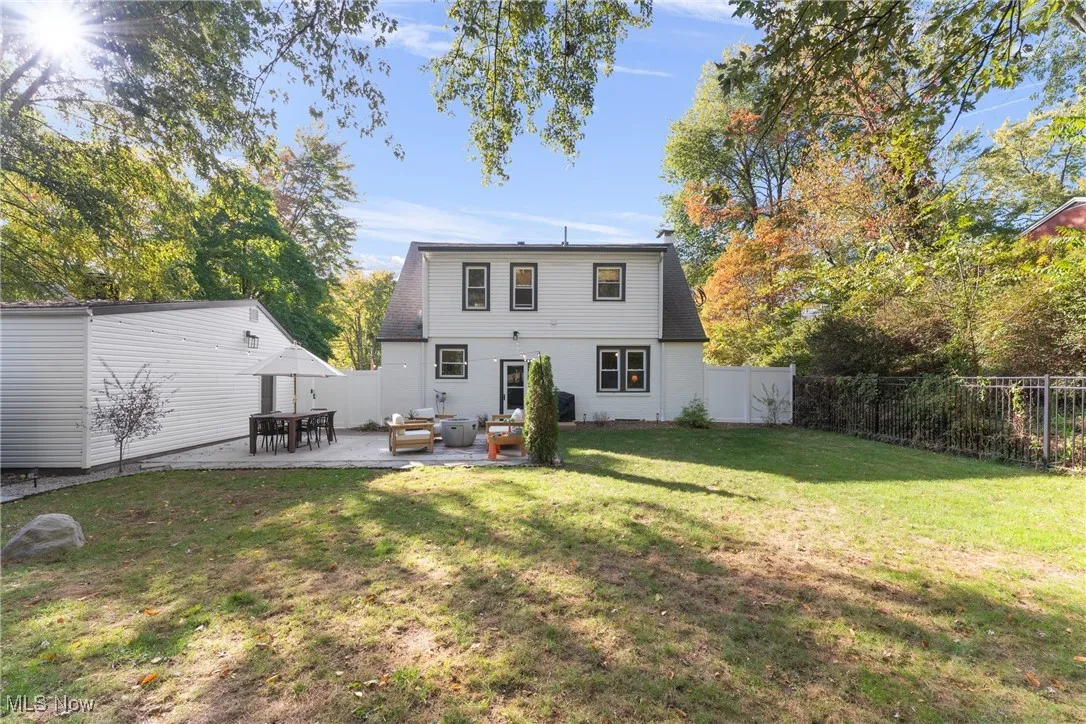 Back of house featuring a patio, a fenced backyard, and outdoor lounge area