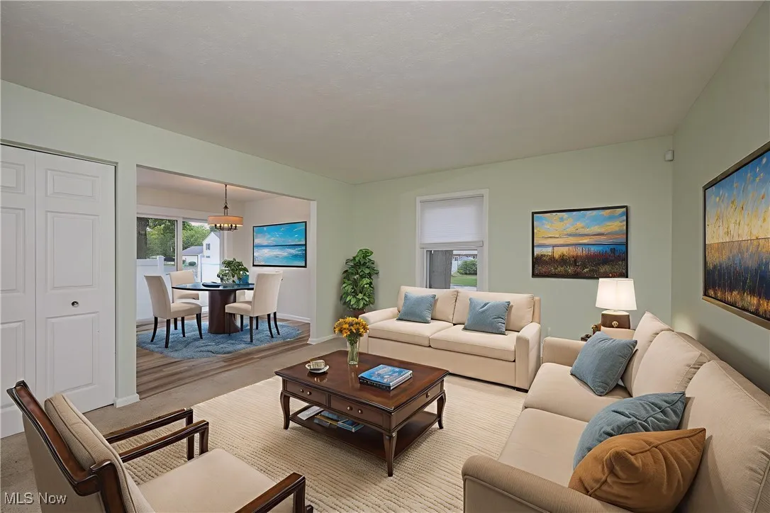 Living area with carpet and baseboards