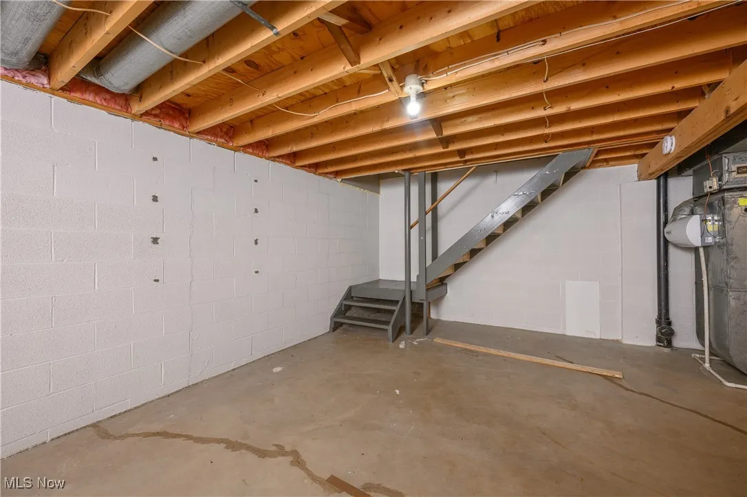 Unfinished basement featuring stairs