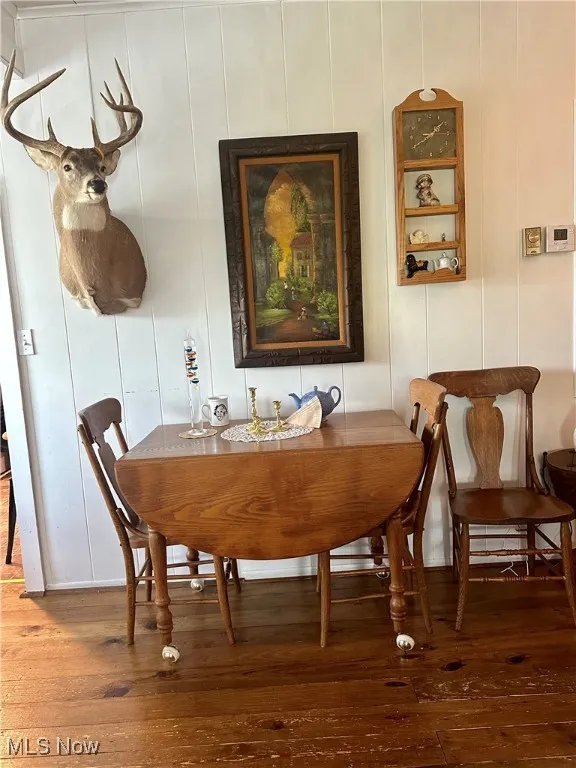 Dining room with hardwood / wood-style flooring
