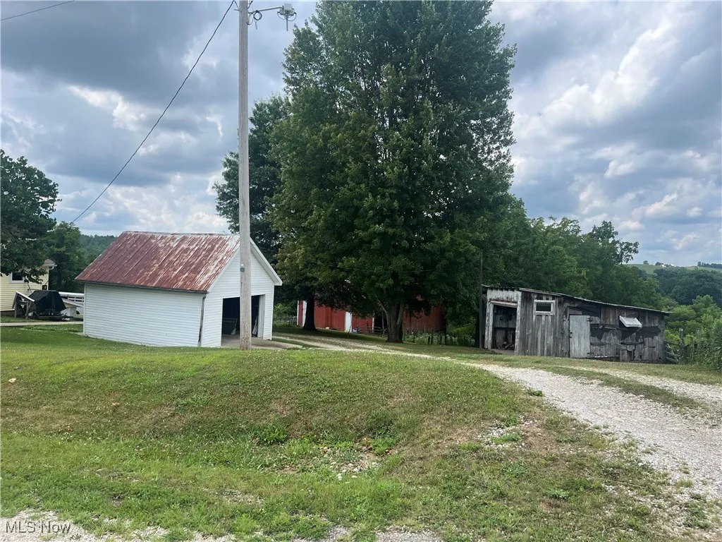Driveway, garage and outbuilding.