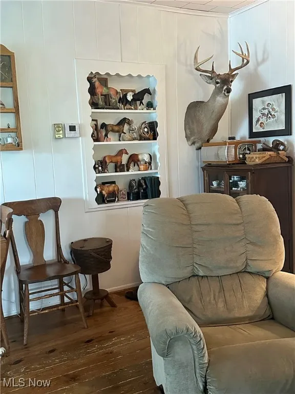 Living room with dark wood-type flooring