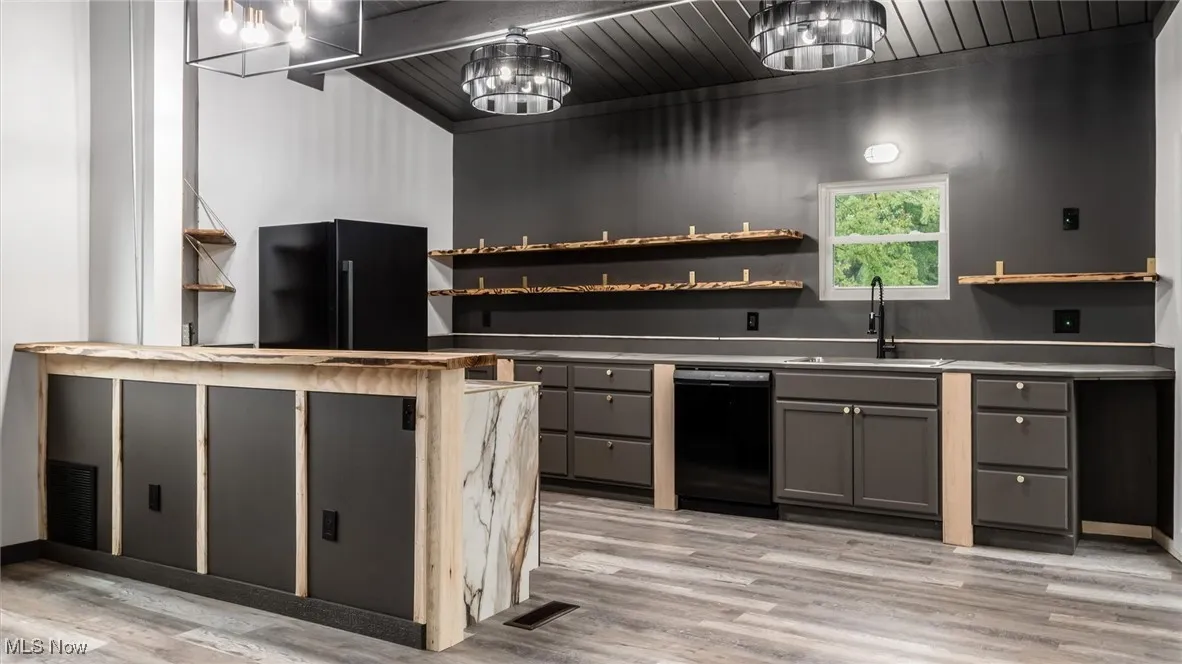 Kitchen with gray cabinetry, open shelves, dishwasher, light wood finished floors, and wood ceiling