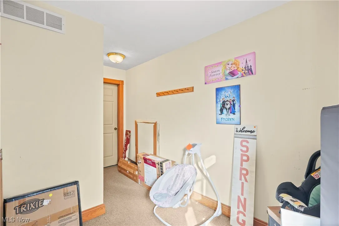 Playroom with carpet and baseboards