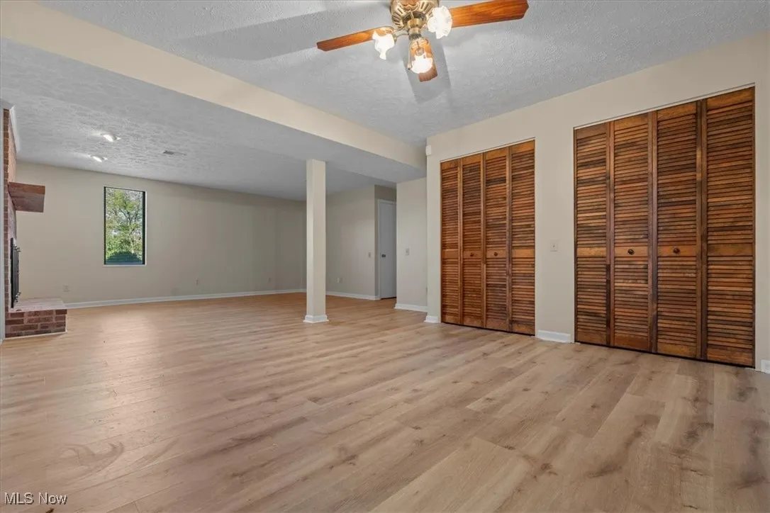 2nd view of Lower Level Family Room with closets