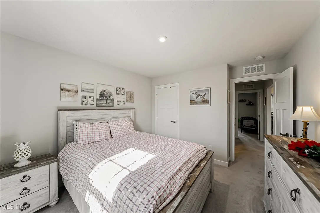 Bedroom featuring carpet and recessed lighting