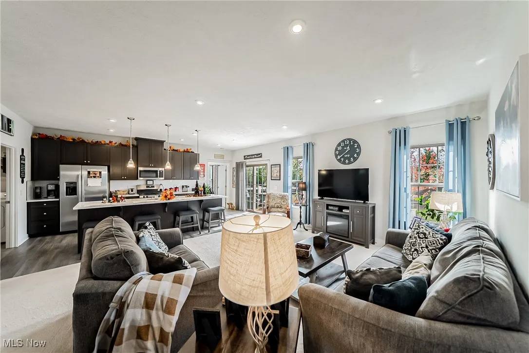 Living room with recessed lighting and wood finished floors