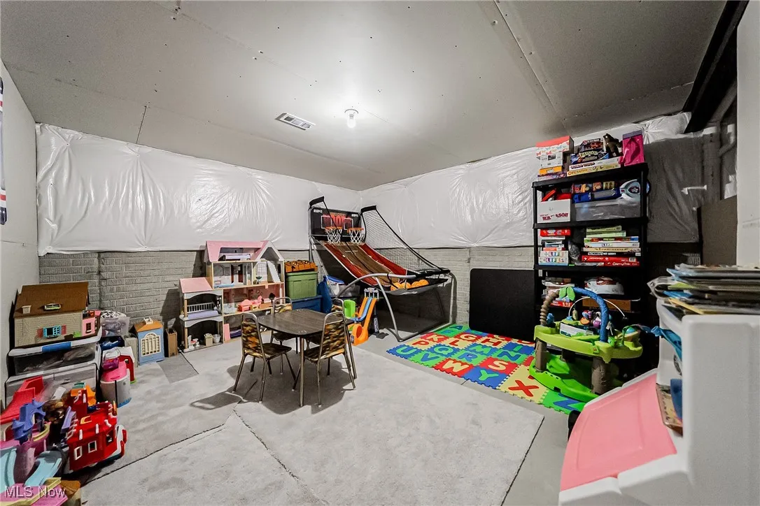 Playroom with concrete flooring