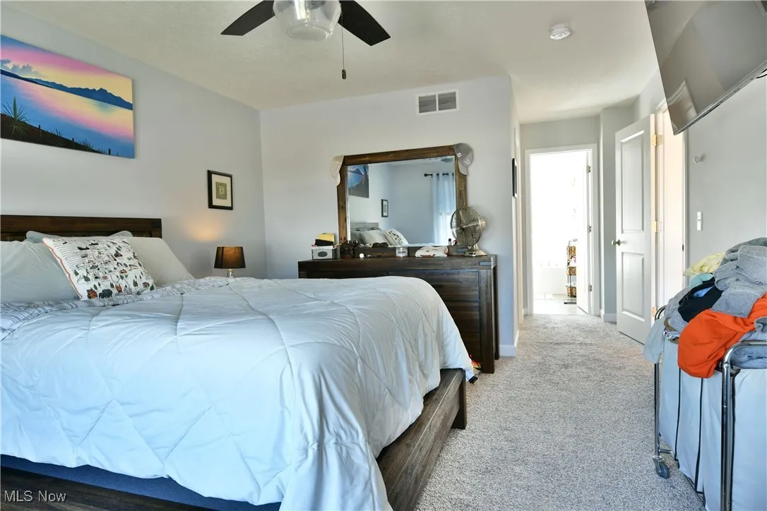 Bedroom with carpet floors and ceiling fan