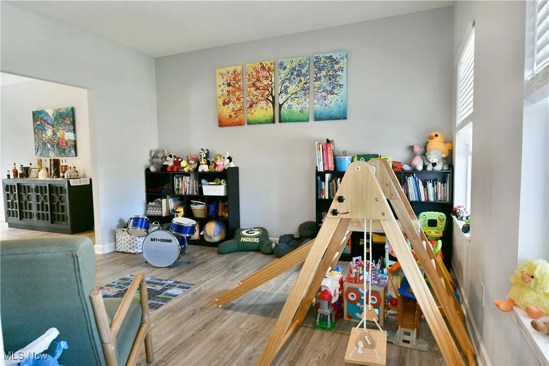 Recreation room featuring wood finished floors