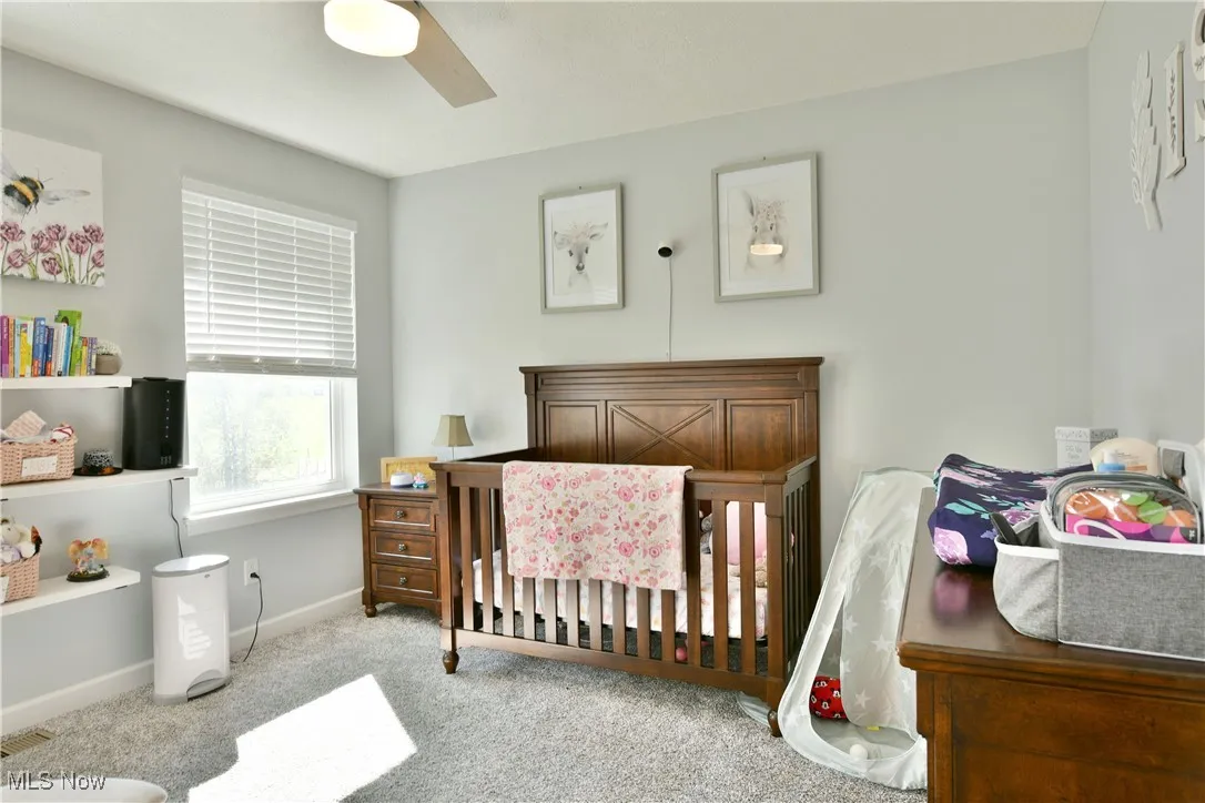 Bedroom with carpet floors and ceiling fan