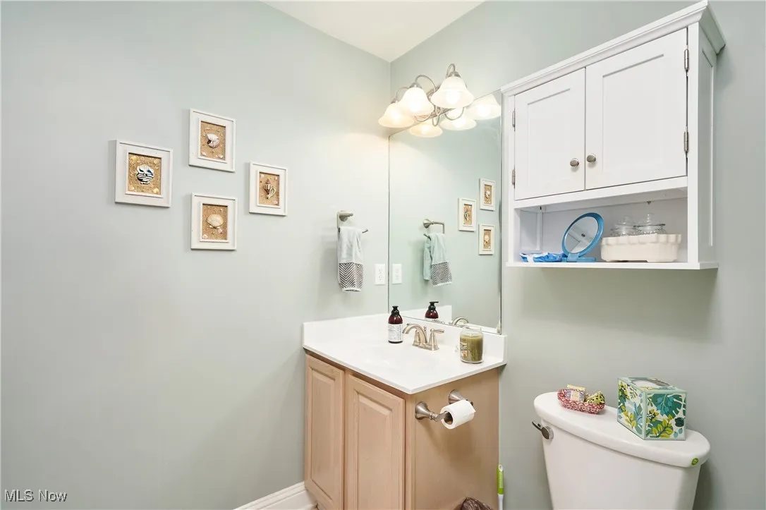 Half bath with vanity and toilet