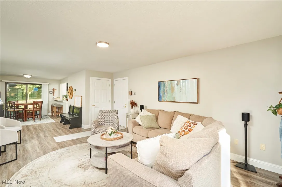 Living area with light wood-type flooring and baseboards