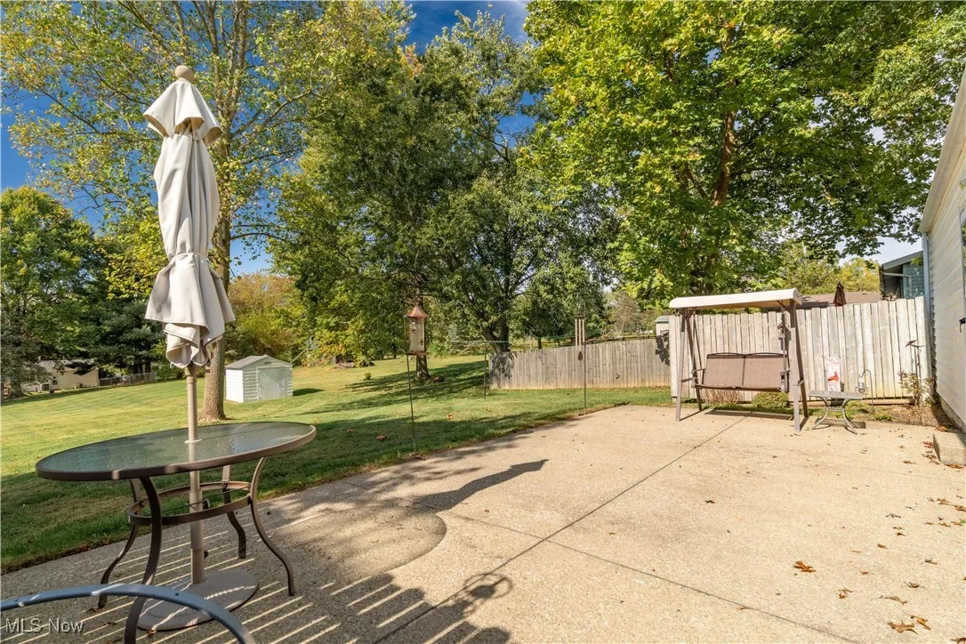 Beautiful patio setting with a gorgeous open yard view — a perfect spot to relax and enjoy the outdoors.