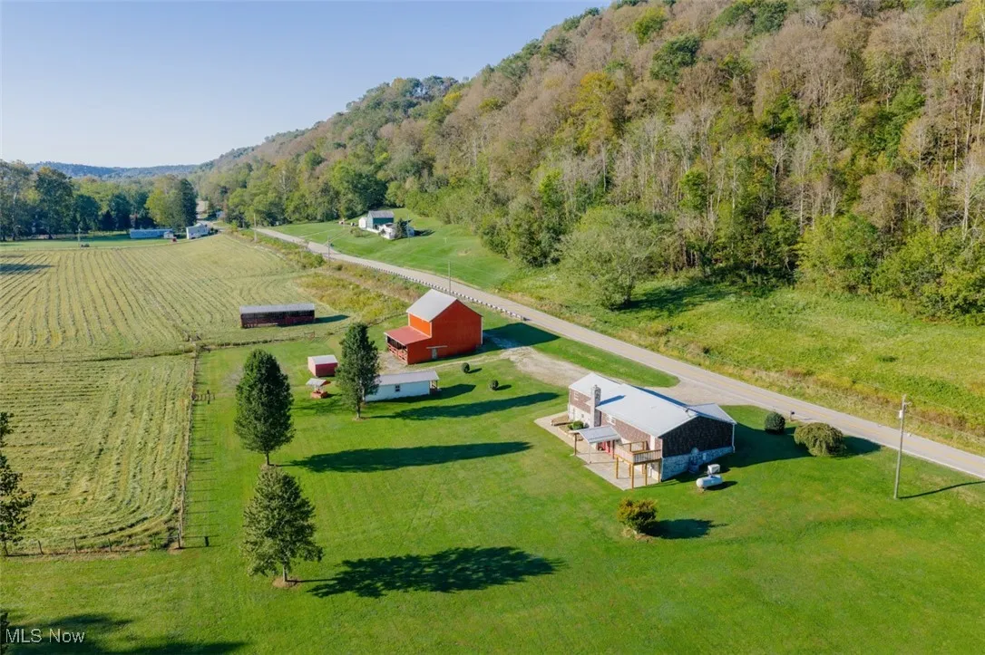 Overview of rural landscape featuring a heavily wooded area