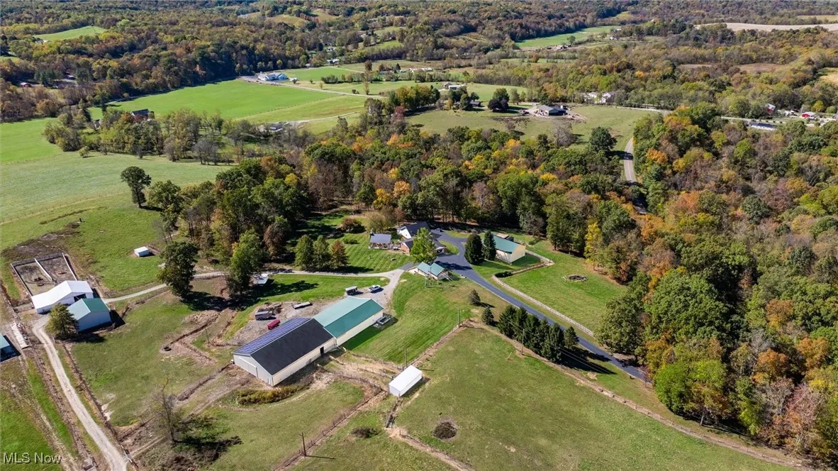 Aerial overview of property's location featuring a forest