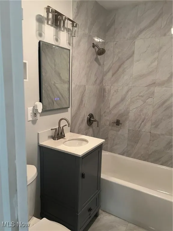 Full bath with bathing tub / shower combination and vanity