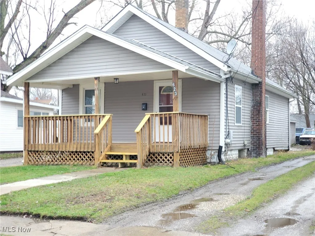 Bungalow-style home featuring a front lawn