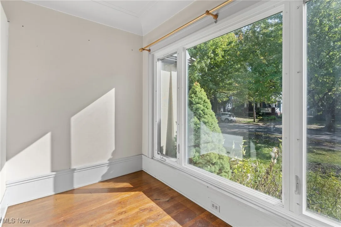 Empty room featuring hardwood / wood-style flooring