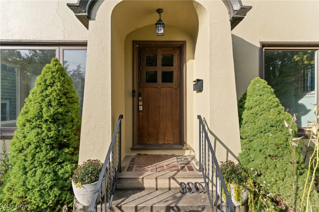View of exterior entry featuring stucco siding
