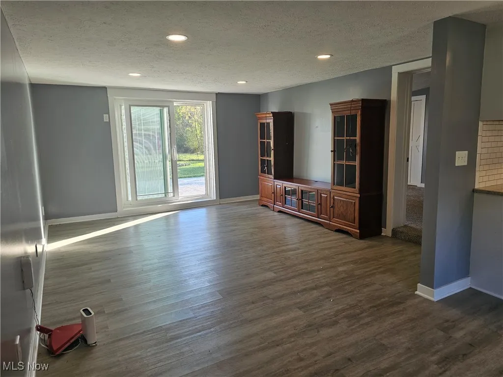 Living room leads out to the fenced back yard.