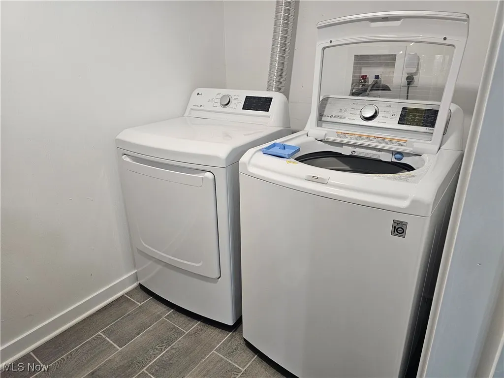 Laundry room with washing machine and clothes dryer