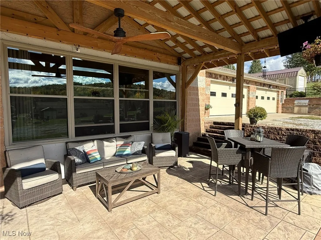 View of patio with an outdoor hangout area, outdoor dining space, and area for grilling