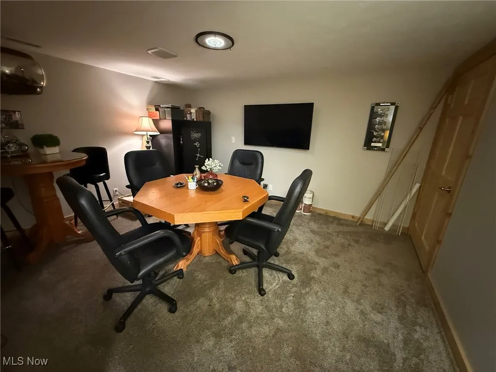 Office with carpet floors and baseboards