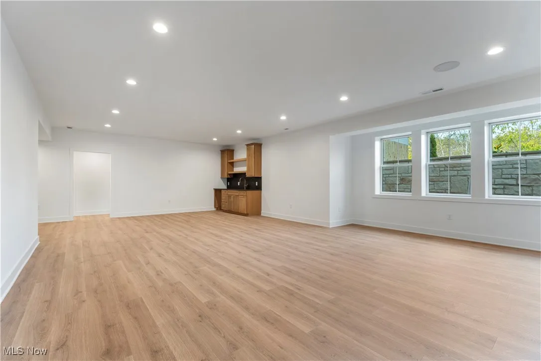 Unfurnished living room featuring recessed lighting and light wood-style floors