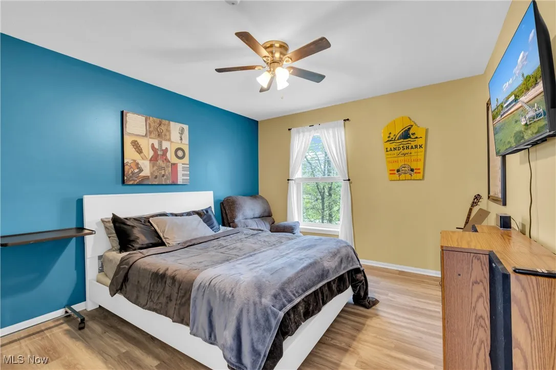Bedroom featuring light wood-style floors and ceiling fan