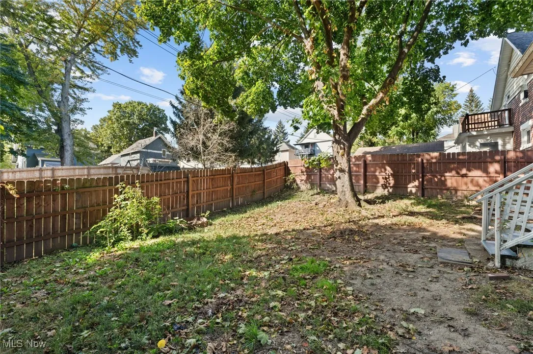 View of fenced backyard