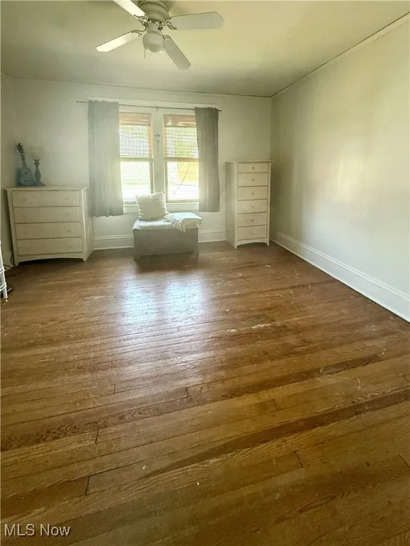 Bedroom #2 featuring wood-style floors and a ceiling fan