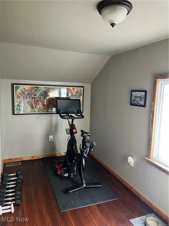 Exercise room with dark wood-type flooring